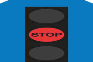 Eine Ampel mit rotem Haltesignal auf blauem Hintergrund.